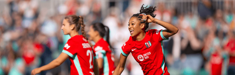 Croix celebrating with Ally and Deb in the back.