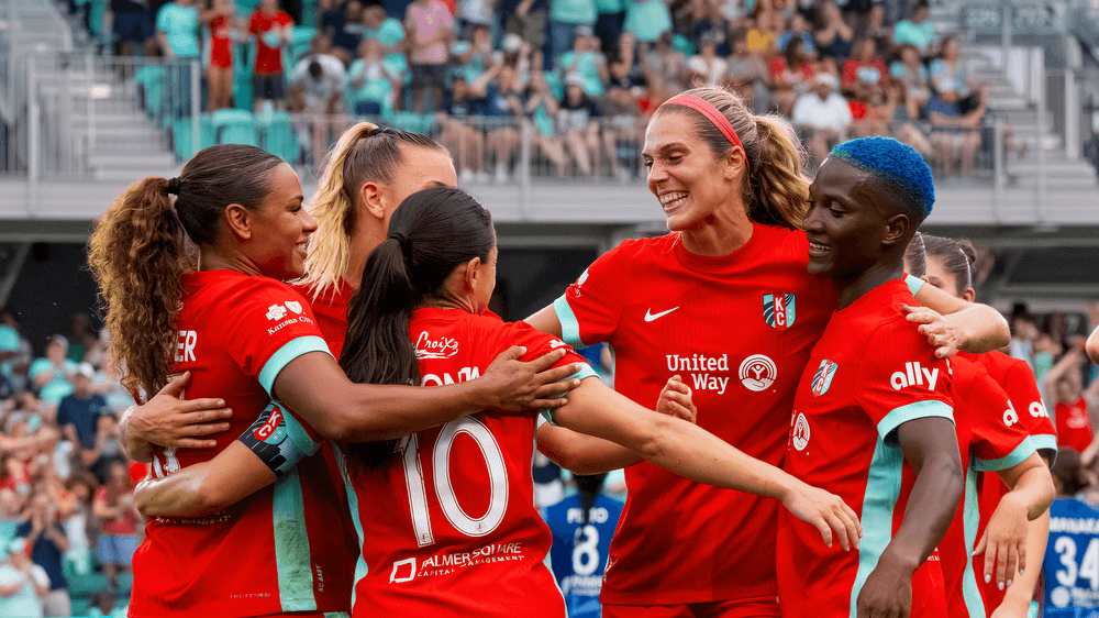 Team celebrating goal as image for match report.