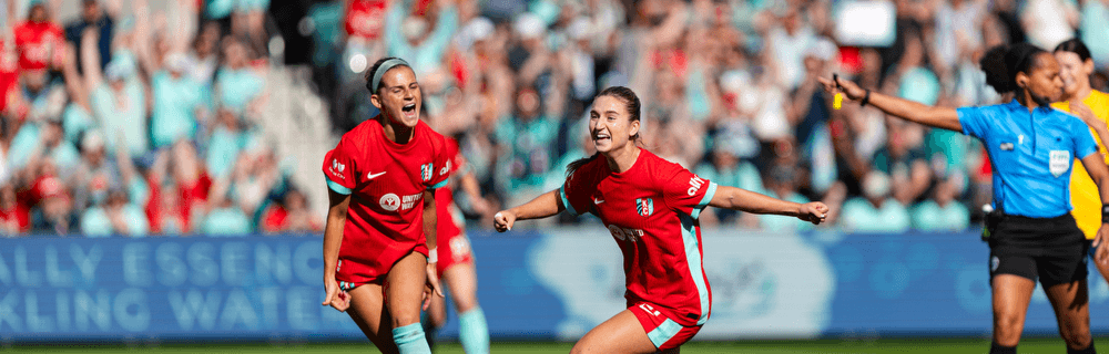 KC Current Players celebrating for match report cover photo.