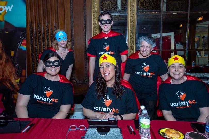 Photo of Molly Gardner and five other individuals in super hero attire.